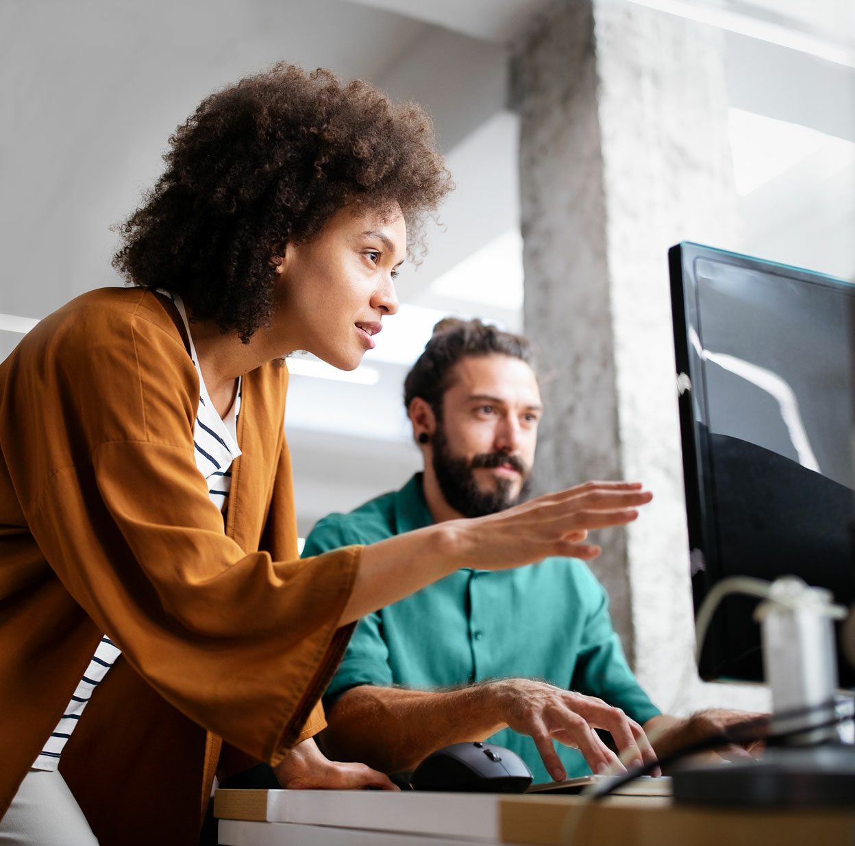 Male and Female Employee at Computer