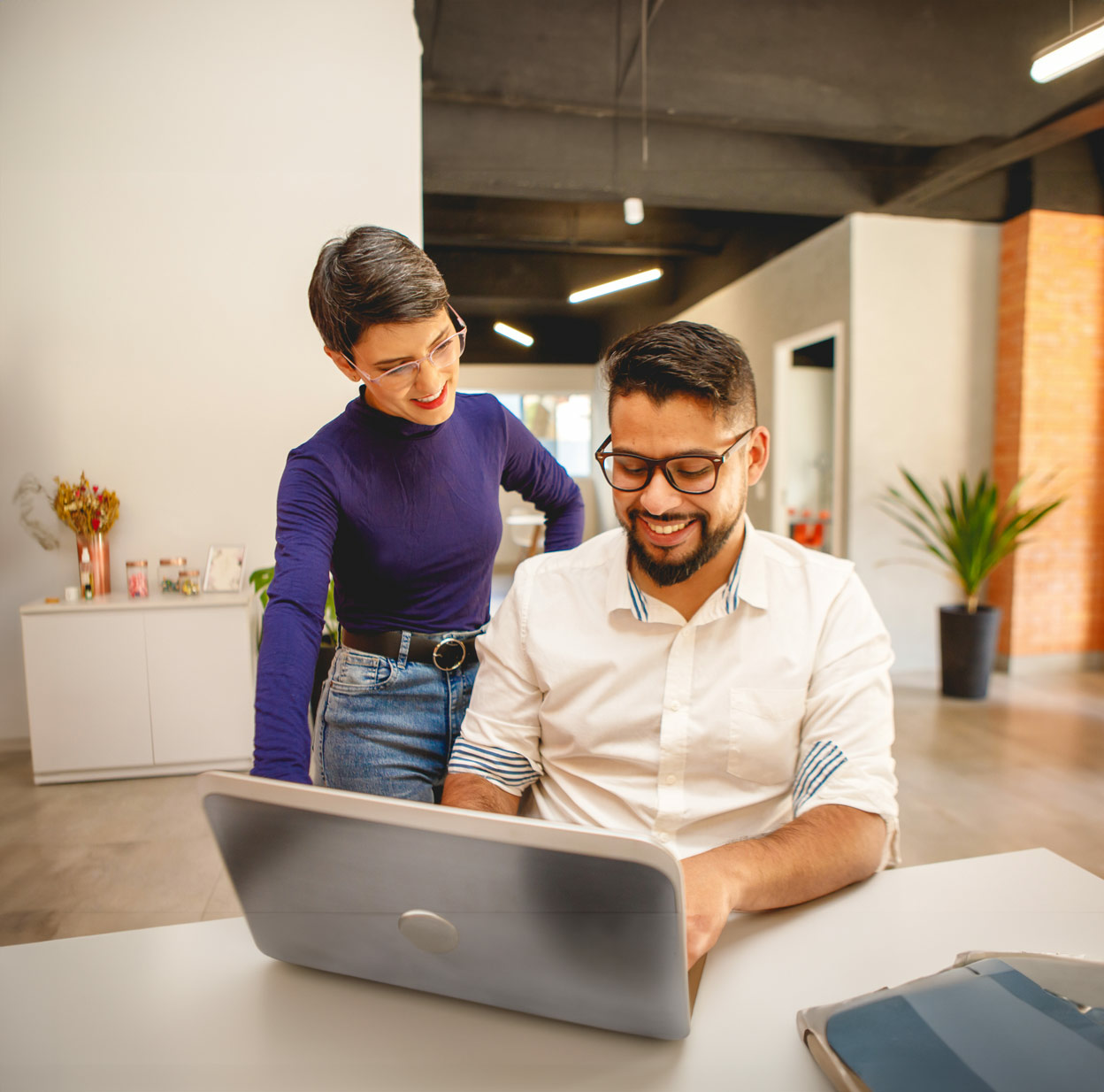 Male and Female Co-workers Collaborating